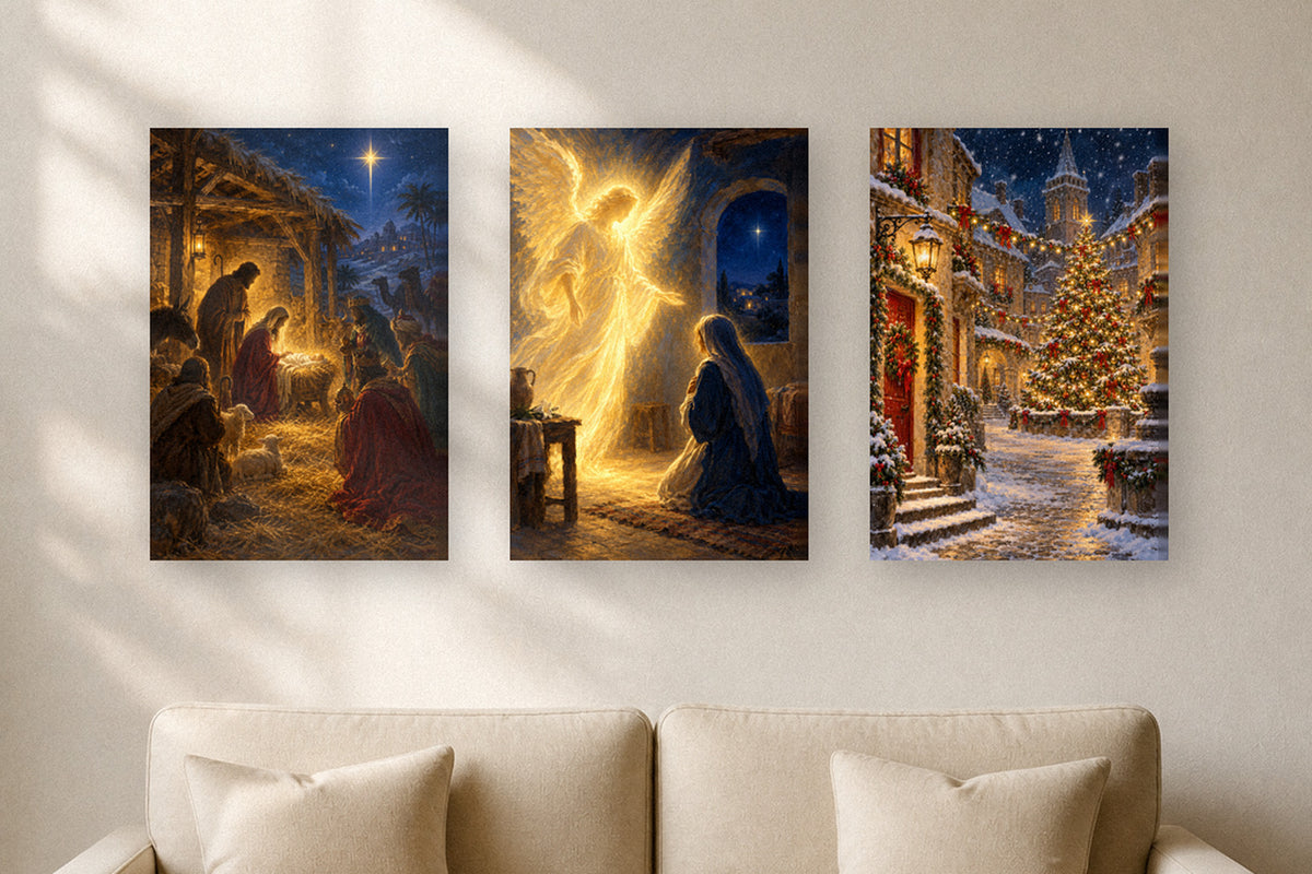Nativity, annunciation and snowy village Christmas canvases above a cream sofa